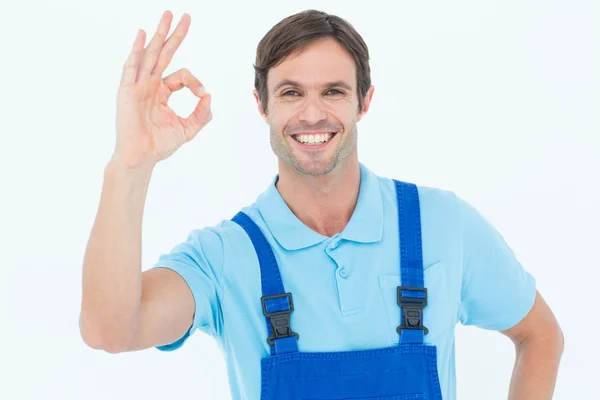 Smiling carpenter showing OK sign — Stock Photo, Image