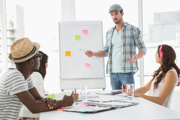 Businessman presenting and colleagues listening — Stock Photo, Image