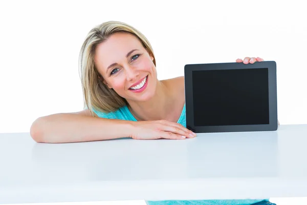 Blonde posing and showing tablet — Stock Photo, Image