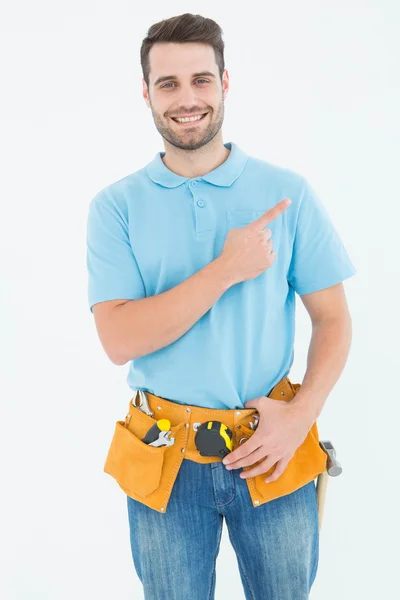 Happy carpenter pointing — Stock Photo, Image