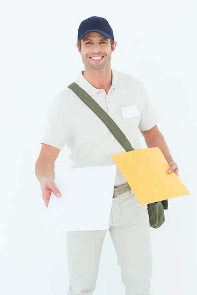 Happy courier man giving parcel — Stock Photo, Image