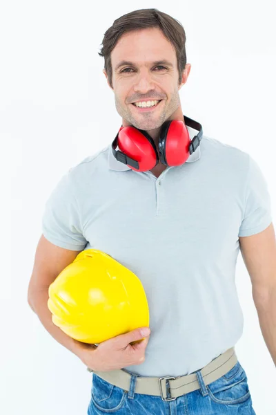 Carpenter with hard hat and ear protectors — Stock Photo, Image