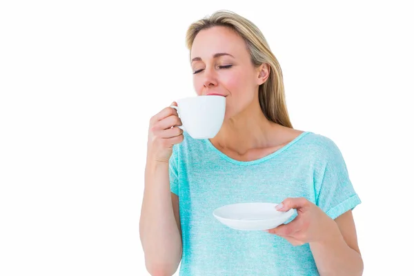 Blonde drinking hot beverage — Stock Photo, Image