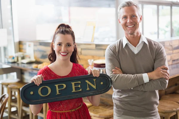 Cafe owners smiling at camera — Stock Photo, Image