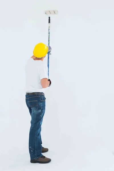 Man painting with roller — Stock Photo, Image
