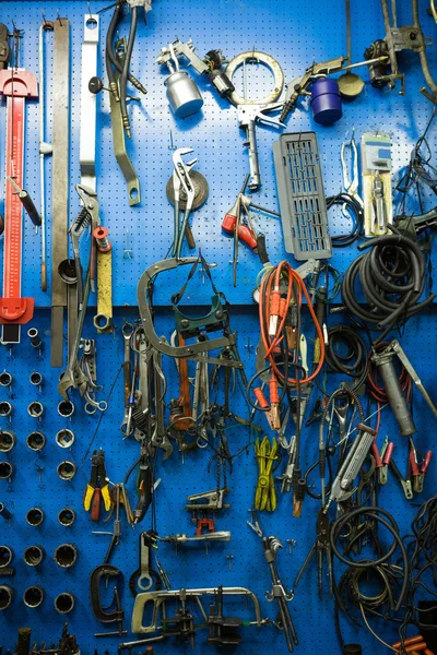 Blue storage wall for tools — Stock Photo, Image