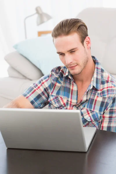 Cheerful man on a laptop — Stock Photo, Image