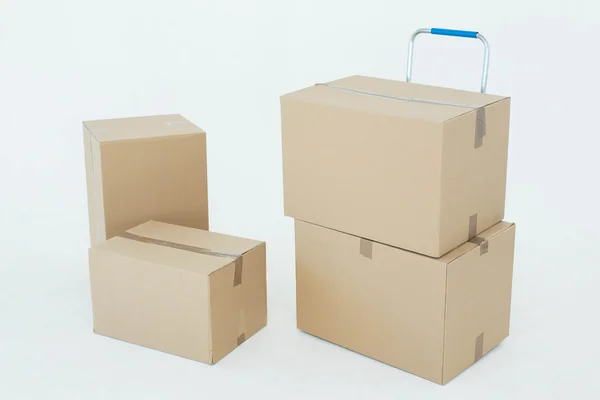 Cardboard boxes with trolley — Stock Photo, Image