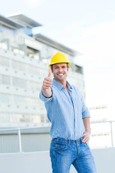 Smiling architect gesturing thumbs up — Stock Photo, Image