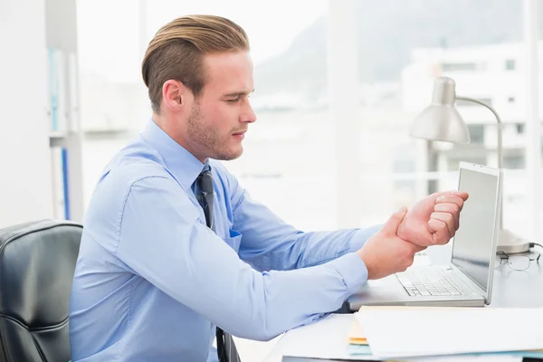 Businessman suffering from wrist pain — Stock Photo, Image