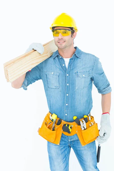 Carpenter carrying wooden planks — Stock Photo, Image