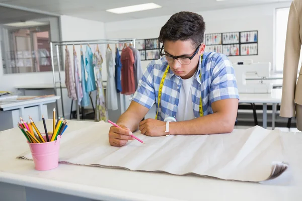 Concentrated college student drawing on paper — Stock Photo, Image