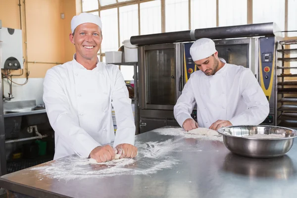 Team of bakers working together — Stock Photo, Image