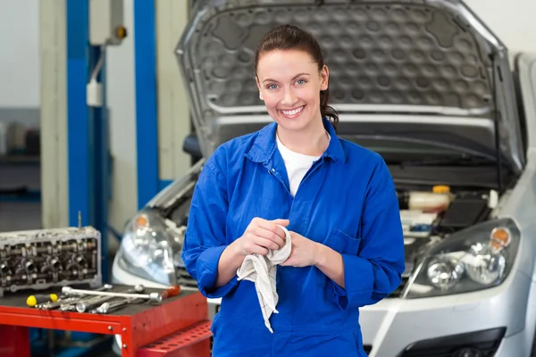 Mechanic wiping hands with rag Royalty Free Stock Images