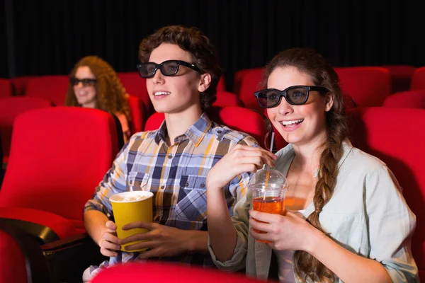 Young couple watching a 3d film Royalty Free Stock Photos