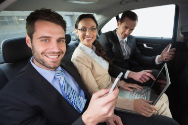 Business team working in the back seat clipart
