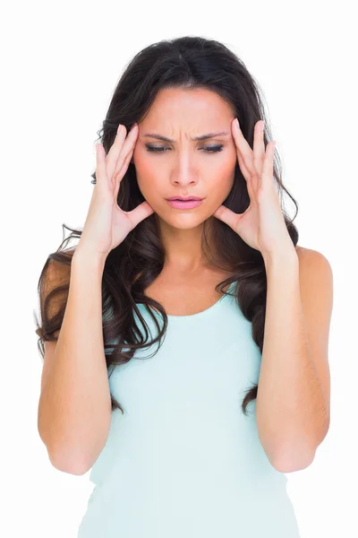 Pretty brunette getting a headache — Stock Photo, Image