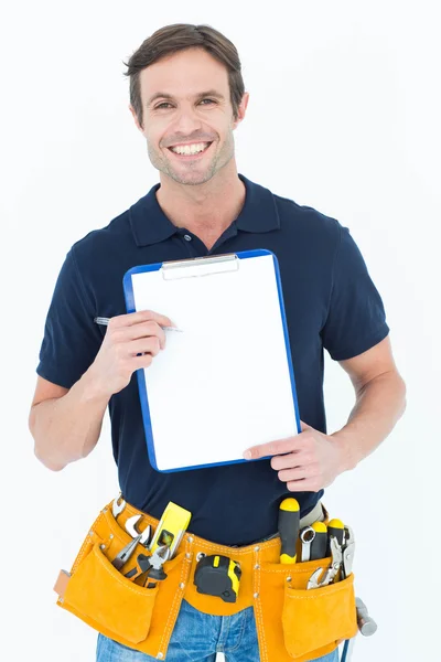 Carpenter showing blank clipboard — Stock Photo, Image