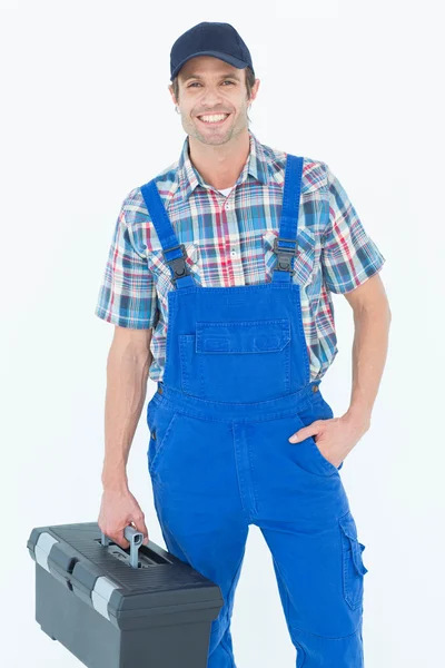 Confident plumber carrying tool box — Stock Photo, Image