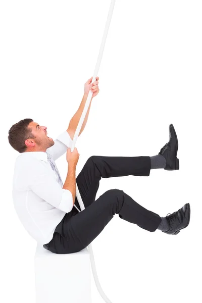 Businessman pulling a rope — Stock Photo, Image