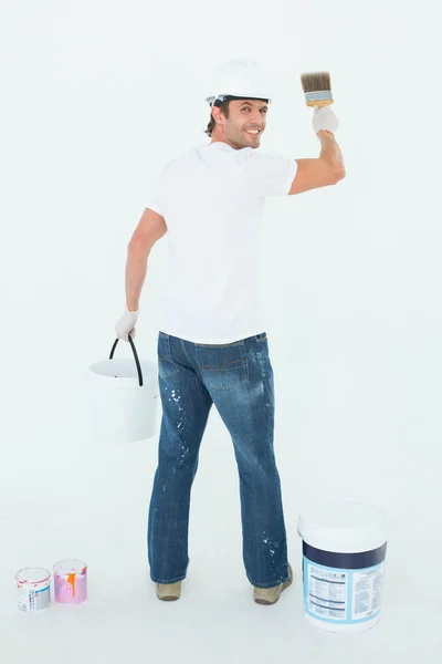 Happy man using paintbrush — Stock Photo, Image