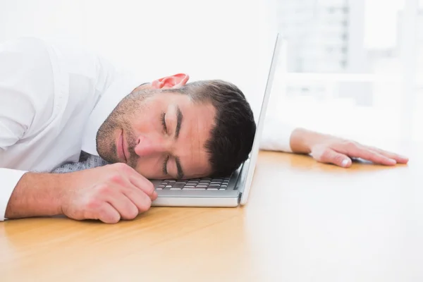 Businessman sleeping in his computer — Stock Photo, Image