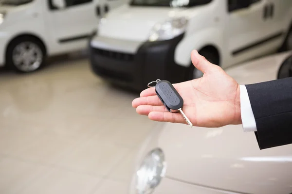 Close up of businessman holding car key — Stock Photo, Image