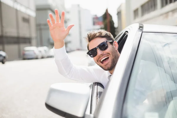 Happy businessman in the drivers seat — Stock Photo, Image