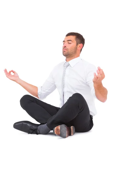 Uomo d'affari meditando in posa loto — Foto Stock