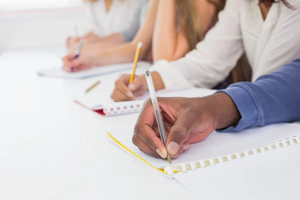 Students taking notes in class — Stock Photo, Image