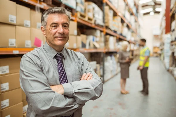 Smiling businessman with crossed arms — Stock Photo, Image