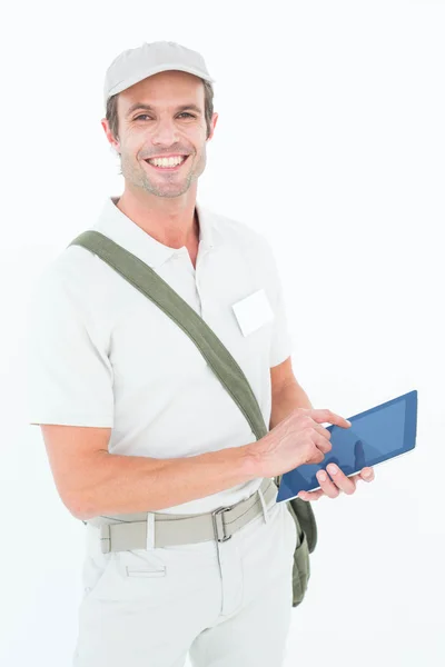 Happy delivery man using tablet — Stock Photo, Image