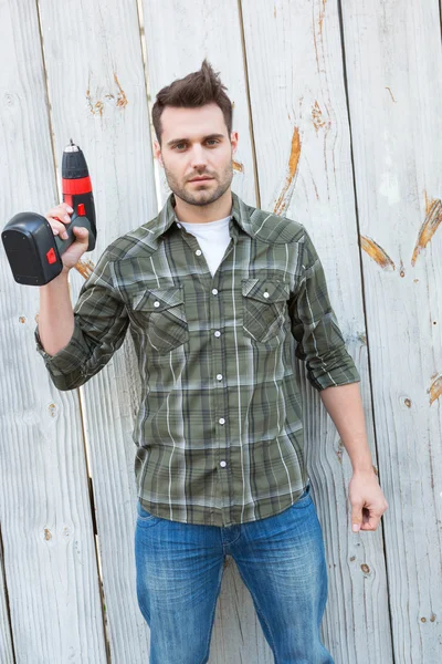 Jistý carpenter drží ruční vrtačka — Stock fotografie