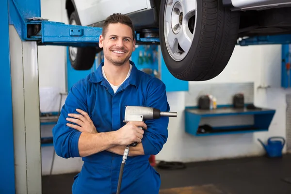 Mechanic holding a drill tool — Stock Photo, Image