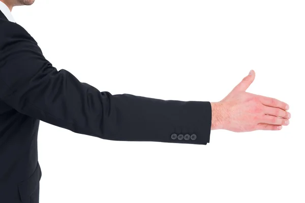 Businessman in suit offering his hand — Stock Photo, Image