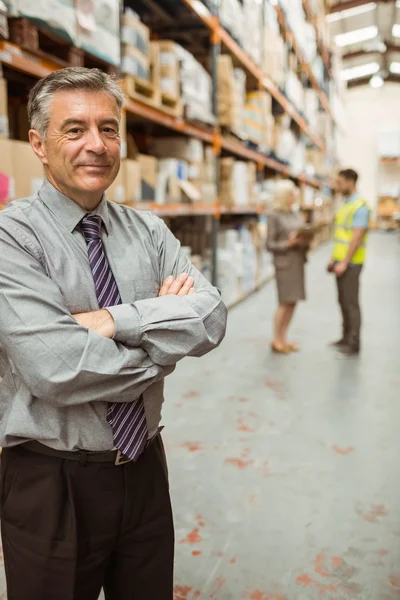 Smiling businessman with crossed arms — Stock Photo, Image