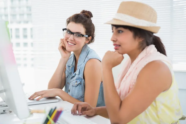 Smiling designer near her colleague — Stock Photo, Image