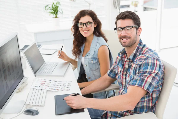 Businessman using laptop and digitizer — Stock Photo, Image