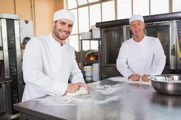 Team of bakers working together — Stock Photo, Image