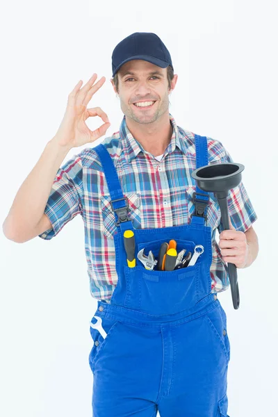 Plumber holding plunger gesturing OK — Stock Photo, Image