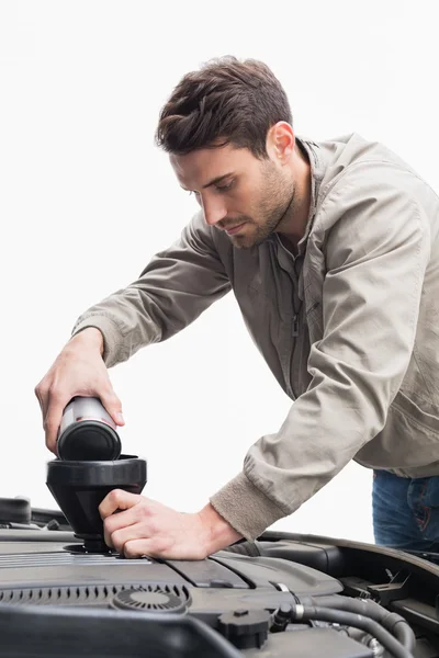 Man pouring oil into engine — Stock Photo, Image