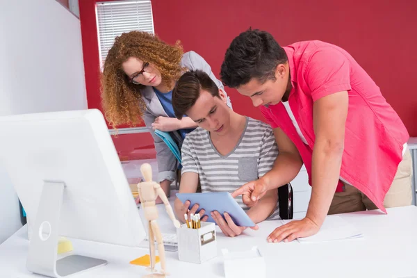 Students working together on tablet pc — Stock Photo, Image