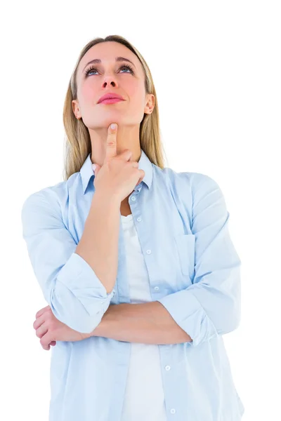 Thoughtful blonde with hand on chin — Stock Photo, Image