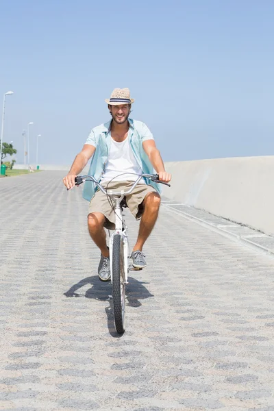 Handsome man on a bike ride — Stock Photo, Image