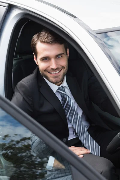 Businessman sitting in drivers seat — Stock Photo, Image
