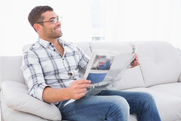 Smiling man with a newspaper — Stock Photo, Image