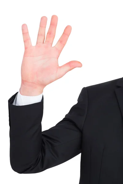 Businessman in suit with hand raised — Stock Photo, Image