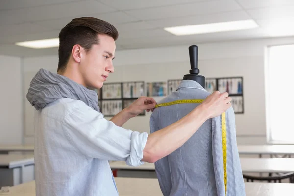 Fashion student working on mannequin — Stock Photo, Image