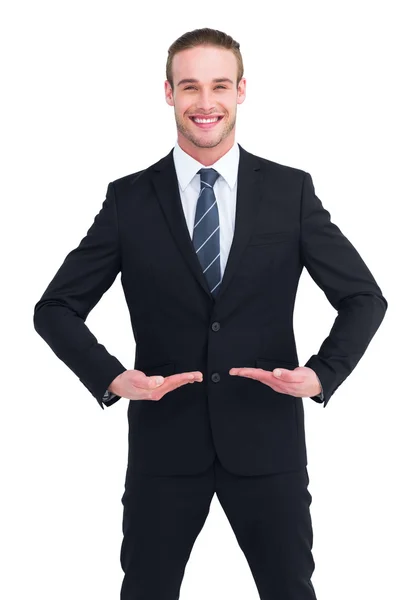 Happy businessman standing with hands out — Stock Photo, Image