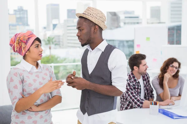 Serious coworkers standing and interacting — Stock Photo, Image